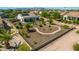 Aerial view of a landscaped backyard featuring desert landscaping, walkways, a covered patio, and privacy fencing at 1775 N 164Th Dr, Goodyear, AZ 85395