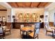 Full bar area featuring rich wood, granite counters and comfortable seating, perfect for socializing at 1775 N 164Th Dr, Goodyear, AZ 85395