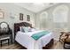 Cozy bedroom featuring a comfortable bed, soft lighting, and stylish decor at 1775 N 164Th Dr, Goodyear, AZ 85395