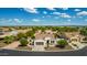 Charming single-story home with a tile roof, desert landscaping, and an attached two-car garage at 1775 N 164Th Dr, Goodyear, AZ 85395