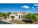 Charming single-story home with a well-maintained front yard, two-car garage, and inviting front porch at 1775 N 164Th Dr, Goodyear, AZ 85395