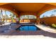 Relaxing hot tub under a covered area for year-round enjoyment at 1775 N 164Th Dr, Goodyear, AZ 85395
