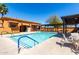 Inviting pool area featuring lounge chairs and an outdoor kitchen area at 1775 N 164Th Dr, Goodyear, AZ 85395
