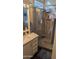 Modern bathroom featuring a walk-in shower with decorative stone flooring and tiled niche at 2058 S Walla Walla Cir, Apache Junction, AZ 85119