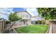 Spacious backyard with well-maintained lawn and covered patio at 23217 N 22Nd Pl, Phoenix, AZ 85024