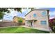 Well-maintained backyard featuring a manicured lawn and covered patio at 23217 N 22Nd Pl, Phoenix, AZ 85024