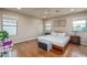 Spacious bedroom with hardwood floors, neutral paint, and a ceiling fan at 23217 N 22Nd Pl, Phoenix, AZ 85024