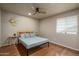 Neutral bedroom with wood floors and a ceiling fan at 23217 N 22Nd Pl, Phoenix, AZ 85024