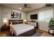 Stylish bedroom with modern furniture, neutral paint, wooden bed frame, and minimalist artwork at 23217 N 22Nd Pl, Phoenix, AZ 85024