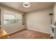 Neutral bedroom with hardwood floors and a large window at 23217 N 22Nd Pl, Phoenix, AZ 85024