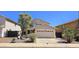 Charming two-story home featuring a two-car garage and desert landscaping at 23217 N 22Nd Pl, Phoenix, AZ 85024