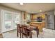 Eat-in kitchen features oak cabinets, granite countertops and stainless steel appliances at 23217 N 22Nd Pl, Phoenix, AZ 85024