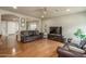 Large open-concept living area with hardwood floors and a neutral color scheme at 23217 N 22Nd Pl, Phoenix, AZ 85024