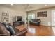 Bright living room with hardwood floors, neutral walls, ceiling fan and recessed lighting at 23217 N 22Nd Pl, Phoenix, AZ 85024