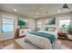 Bright main bedroom featuring a ceiling fan, recessed lighting, and coordinating artwork and decor at 23217 N 22Nd Pl, Phoenix, AZ 85024
