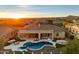 Gorgeous backyard with a pool, spa, outdoor kitchen, and lush landscaping at 2333 N 87Th Pl, Mesa, AZ 85207