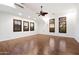 The large bedroom with plank floors features multiple windows for abundant natural light at 2333 N 87Th Pl, Mesa, AZ 85207