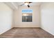 Bedroom featuring a large window with an outdoor view and neutral carpet and color scheme at 2333 N 87Th Pl, Mesa, AZ 85207