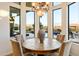 Charming breakfast nook with floor-to-ceiling windows offering views of the pool and landscaped backyard at 2333 N 87Th Pl, Mesa, AZ 85207