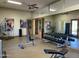Gym with multiple exercise stations and equipment, flanked by framed prints at 2333 N 87Th Pl, Mesa, AZ 85207