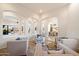 Elegant living room with arched openings, creating a seamless flow for entertaining at 2333 N 87Th Pl, Mesa, AZ 85207