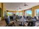 Covered outdoor patio features a stone fireplace, ample seating, and scenic views at 2333 N 87Th Pl, Mesa, AZ 85207
