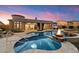 Resort-style pool and spa with fire feature create a relaxing backyard oasis at 2333 N 87Th Pl, Mesa, AZ 85207