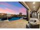 This backyard features a beautiful pool, spa, basketball court, outdoor seating and lush desert landscaping at 2333 N 87Th Pl, Mesa, AZ 85207