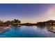 Stunning community pool at sunset with a lovely view and ample seating at 2333 N 87Th Pl, Mesa, AZ 85207