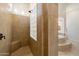 This shower features neutral-colored tiling with a glass-block window and a built-in bench at 2333 N 87Th Pl, Mesa, AZ 85207