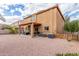 The backyard has a covered patio with an outdoor dining area and barbeque at 24805 W Vista Norte St, Buckeye, AZ 85326