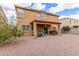 A spacious backyard with a covered patio and outdoor furniture at 24805 W Vista Norte St, Buckeye, AZ 85326