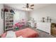 A bedroom with toys and pink accents at 24805 W Vista Norte St, Buckeye, AZ 85326