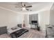 A neutral toned bedroom with a ceiling fan and decorative LED lighting at 24805 W Vista Norte St, Buckeye, AZ 85326
