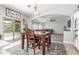 Dining room featuring a wooden table, decorative rug, and sliding glass doors at 24805 W Vista Norte St, Buckeye, AZ 85326