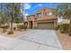 Inviting two-story home boasting a tile roof, two-car garage, and a beautifully landscaped front yard at 24805 W Vista Norte St, Buckeye, AZ 85326