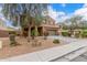 Home featuring gravel landscaping, a tile roof, and native vegetation at 24805 W Vista Norte St, Buckeye, AZ 85326