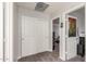 Upstairs hallway between rooms with double doors and carpeted floors at 24805 W Vista Norte St, Buckeye, AZ 85326