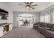 Open-concept living room with plush seating and seamless flow to the kitchen at 24805 W Vista Norte St, Buckeye, AZ 85326