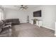 Spacious living room features a comfortable sectional sofa and a modern media console at 24805 W Vista Norte St, Buckeye, AZ 85326