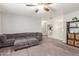 A spacious living room featuring a plush sectional sofa at 24805 W Vista Norte St, Buckeye, AZ 85326