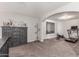 Upstairs living room features a comfortable carpeted area and a storage chest at 24805 W Vista Norte St, Buckeye, AZ 85326