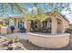 Backyard featuring a covered patio, an outdoor kitchen area with built-in grill, and scenic landscaping at 26336 W Tina Ln, Buckeye, AZ 85396