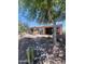 Beautiful backyard featuring desert landscaping, a covered patio, and an outdoor kitchen area at 26336 W Tina Ln, Buckeye, AZ 85396