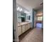 Bathroom featuring a double vanity, tile floors, and updated fixtures at 26336 W Tina Ln, Buckeye, AZ 85396