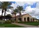Beautiful clubhouse features classic architecture, well-maintained landscaping, and ample parking at 26336 W Tina Ln, Buckeye, AZ 85396
