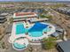 Aerial view of a luxurious community pool with plenty of seating and swimming space at 26336 W Tina Ln, Buckeye, AZ 85396