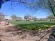 A large dog park with plenty of open space, seating, and shade trees for neighborhood enjoyment at 26336 W Tina Ln, Buckeye, AZ 85396