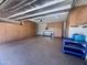 Large garage with ample storage and a workbench area at 26336 W Tina Ln, Buckeye, AZ 85396