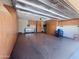 Spacious garage with epoxy floors and ample built-in storage cabinets at 26336 W Tina Ln, Buckeye, AZ 85396